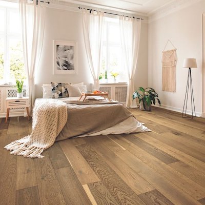 hardwood floors in a bright bedroom